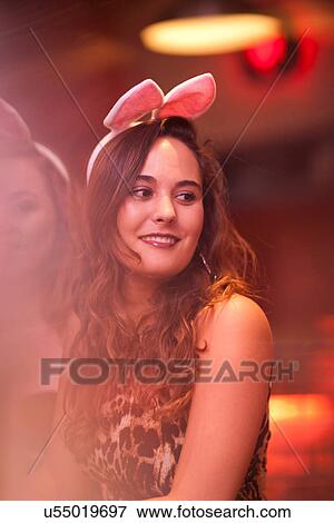 Young women wearing bunny ears at hen party View Large Photo Image Stock Photo - Young women wearing bunny ears at hen party. Fotosearch