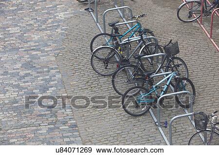 Bicycles chained up to railings View Large Photo Image Stock Photo - Bicycles chained up to railings. Fotosearch