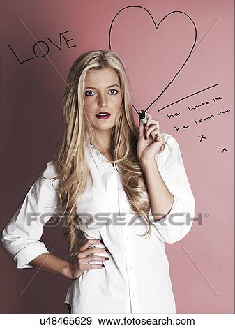 Blonde woman with marker pen drawing hearts View Large Photo Image Stock Photo - Blonde woman with marker pen drawing hearts. Fotosearch