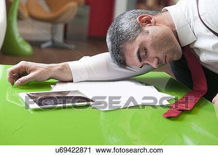 Businessman asleep on documents View Large Photo Image Stock Image - Businessman asleep on documents. Fotosearch