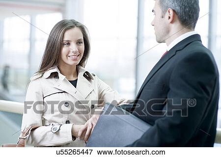 Businesswoman and businessman talking together View Large Photo Image Stock Photo - Businesswoman and businessman talking together. Fotosearch