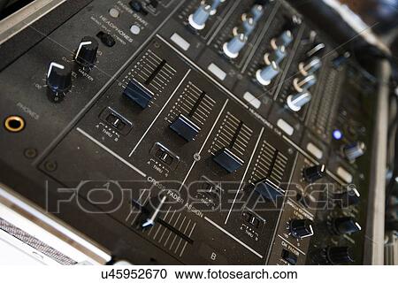 Stock Image - Close up of audio console. Fotosearch