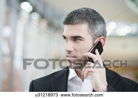 Close-up of businessman on mobile phone View Large Photo Image Stock Image - Close-up of businessman on mobile phone. Fotosearch