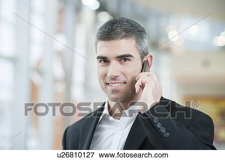 Close-up of businessman on mobile phone View Large Photo Image Stock Photo - Close-up of businessman on mobile phone. Fotosearch