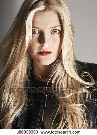 Stock Image - Close-up of pretty blonde woman. Fotosearch