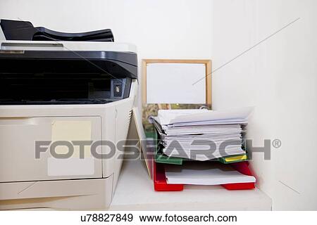Close-up of printer and paperwork in real life office View Large Photo Image Stock Photo - Close-up of printer and paperwork in real life office. Fotosearch