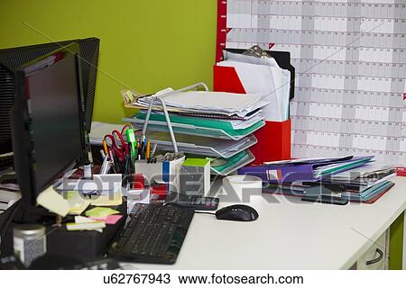 Close-up of real life messy desk in office View Large Photo Image Stock Image - Close-up of real life messy desk in office. Fotosearch