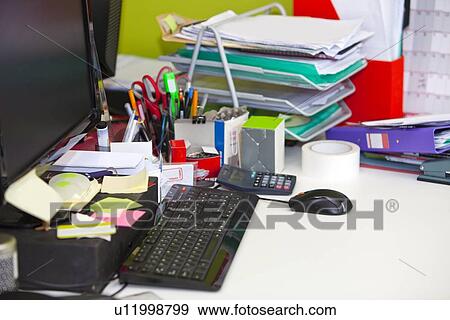 Close-up of real life messy desk in office View Large Photo Image Stock Photo - Close-up of real life messy desk in office. Fotosearch