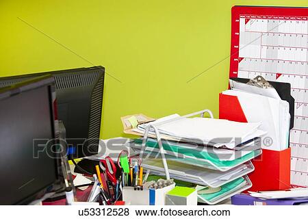 Close-up of real life messy office View Large Photo Image Stock Photo - Close-up of real life messy office. Fotosearch