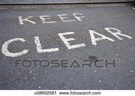 Close-Up of road marking saying Keep Clear in London, UK View Large Photo Image Stock Image - Close-Up of road marking saying Keep Clear in London, UK. Fotosearch