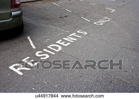 Picture - Close-Up of road marking saying Residents Parking Only in London, UK. Fotosearch