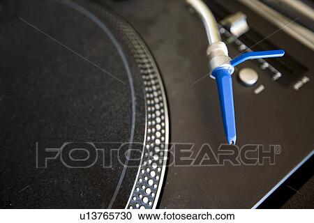 Stock Image - Close-up of turntable and needle. Fotosearch
