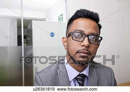 Close-up portrait of Indian Businessman wearing glasses with beard View Large Photo Image Stock Photo - Close-up portrait of Indian Businessman wearing glasses with beard. Fotosearch