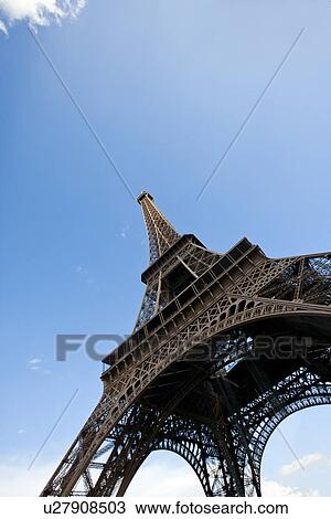 Stock Image - Close-Up view looking up at the Eiffel Tower in Paris, France. Fotosearch