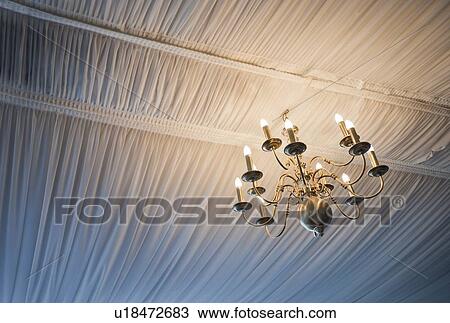 Close-up view of illuminated Chandelier View Large Photo Image Stock Image - Close-up view of illuminated Chandelier . Fotosearch
