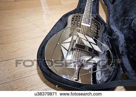Close-up view of resonator guitar in carry case View Large Photo Image Stock Image - Close-up view of resonator guitar in carry case. Fotosearch