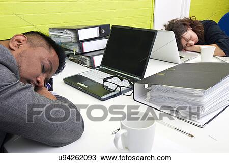 Colleagues asleep at their respective desk View Large Photo Image Stock Image - Colleagues asleep at their respective desk. Fotosearch