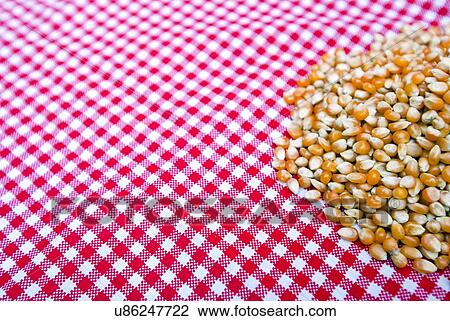 Corn kernels close up on a red and white tablecloth View Large Photo Image Stock Image - Corn kernels close up on a red and white tablecloth. Fotosearch