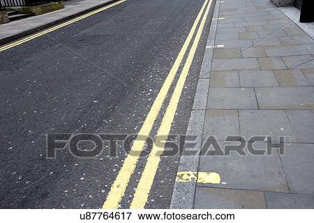 Stock Photo - Double yellow line on London street. Fotosearch