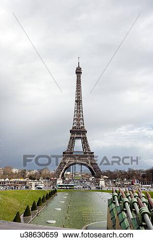 Stock Photo - Eiffel Tower viewed from Champ de Mars Paris France. Fotosearch