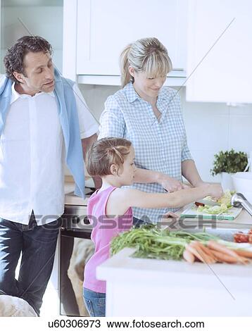 Family making a healthy salad in the kitchen View Large Photo Image Stock Image - Family making a healthy salad in the kitchen. Fotosearch