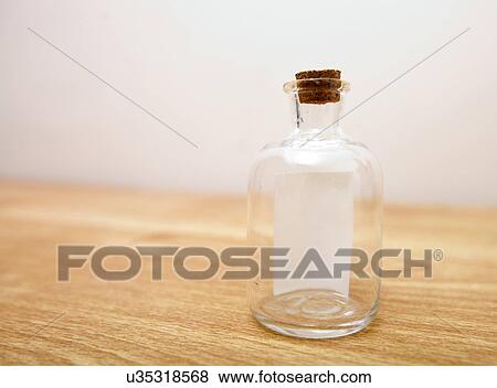 Glass bottle with note inside View Large Photo Image Stock Photo - Glass bottle with note inside. Fotosearch