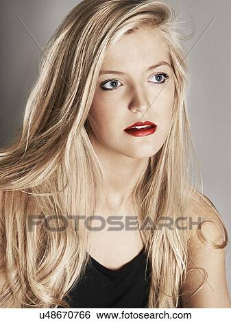 Head shot of pretty young woman looking off camera View Large Photo Image Stock Photograph - Head shot of pretty young woman looking off camera. Fotosearch