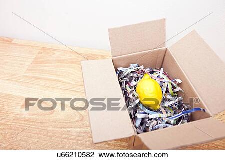 Lemon wrapped up in a box View Large Photo Image Stock Image - Lemon wrapped up in a box. Fotosearch