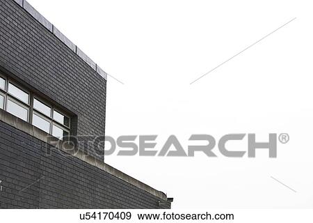 Stock Photo - Low angle view of a surveillance camera on the side of a building. Fotosearch
