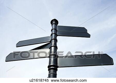 Stock Photography - Metal signs pointing in all sort of directions in London, UK. Fotosearch