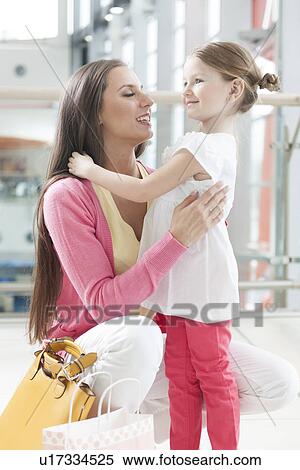Mother and daughter hugging View Large Photo Image Stock Photography - Mother and daughter hugging . Fotosearch