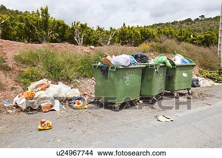 Overflowing bins next to Orange Orchard, Valencia region, Spain View Large Photo Image Picture - Overflowing bins next to Orange Orchard, Valencia region, Spain. Fotosearch