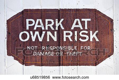 Park at Own Risk sign View Large Photo Image Stock Photograph - Park at Own Risk sign. Fotosearch