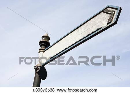 Single Directional sign isolated on blue sky View Large Photo Image Stock Photo - Single Directional sign isolated on blue sky. Fotosearch