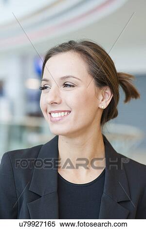 Smiling businesswoman looking off camera View Large Photo Image Stock Photography - Smiling businesswoman looking off camera. Fotosearch