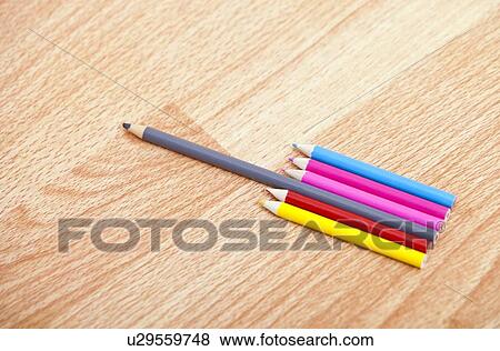 Stock Photo - Studio shot of colored pencils in a row. Fotosearch