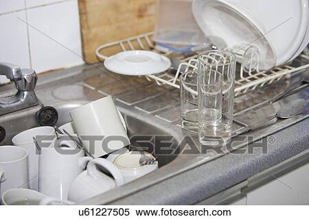 Washing-up in office kitchen sink View Large Photo Image Stock Photography - Washing-up in office kitchen sink. Fotosearch