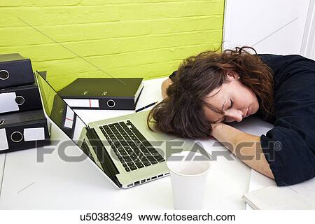 Woman asleep at her desk View Large Photo Image Stock Photo - Woman asleep at her desk. Fotosearch