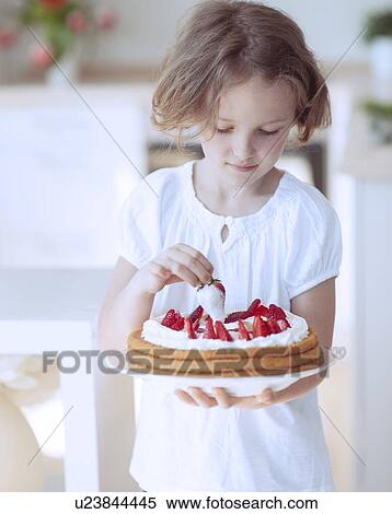 Young girl with cake and strawberries View Large Photo Image Stock Photography - Young girl with cake and strawberries. Fotosearch