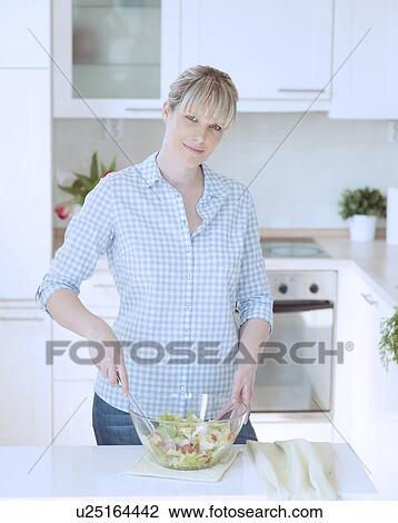 Young woman making salad View Large Photo Image Stock Image - Young woman making salad. Fotosearch