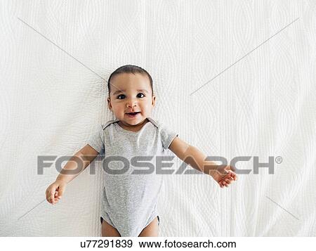 Baby boy (2-5 months) portrait on white View Large Photo Image Stock Photo - Baby boy (2-5 months) portrait on white. Fotosearch
