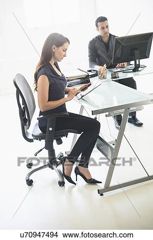 Business people working in office View Large Photo Image Picture - Business people working in office. Fotosearch