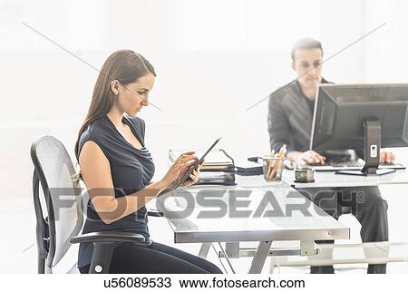 Business people working in office View Large Photo Image Stock Image - Business people working in office. Fotosearch