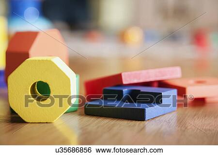 Stock Photograph - Children's toys on floor . Fotosearch