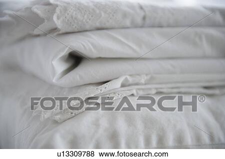 Close up of folded white sheets, studio shot View Large Photo Image Stock Photo - Close up of folded white sheets, studio shot. Fotosearch