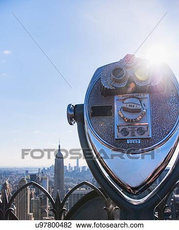 Coin operated binoculars with Empire State Building in background View Large Photo Image Stock Image - Coin operated binoculars with Empire State Building in background. Fotosearch