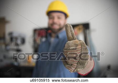 Stock Photography - Construction worker with thumb up. Fotosearch