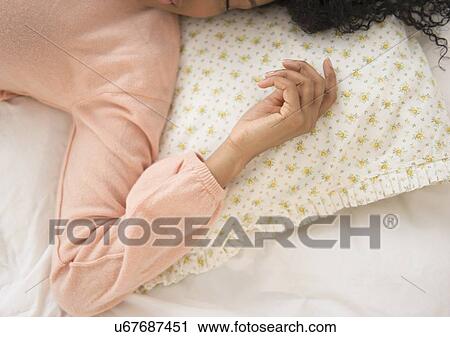 Elevated view of woman sleeping View Large Photo Image Stock Image - Elevated view of woman sleeping. Fotosearch
