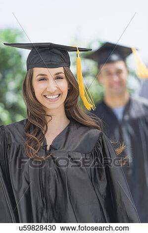 Female and male student on graduation ceremony View Large Photo Image Stock Image - Female and male student on graduation ceremony. Fotosearch