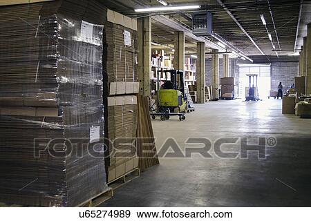 Forklift in warehouse View Large Photo Image Stock Photo - Forklift in warehouse. Fotosearch